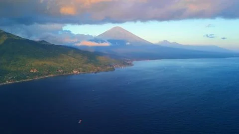 Sunset Clouds Over Mount Agung And Amed Coastline, Bali- Aerial View 스톡 사진