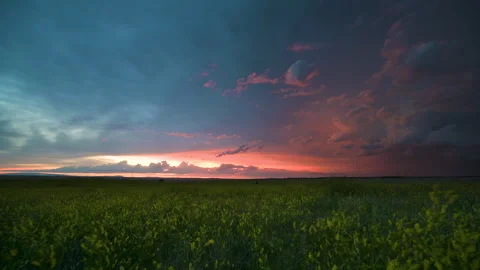 Sunset clouds over nature seamless looping motion background Stock Footage 345616404