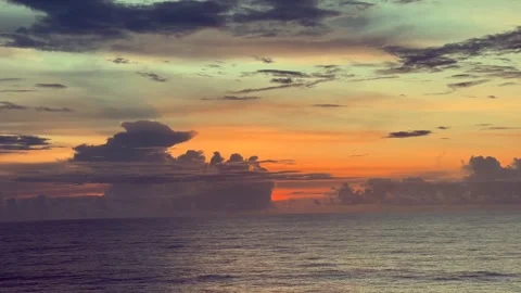 Sunset clouds over the ocean with dramatic colors Stock Footage 338282807