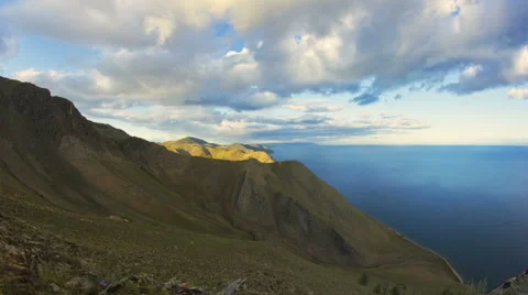 Sunset clouds over rocks timelapse Stock Footage 47084587