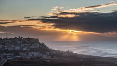 Sunset clouds over Sidi Ifni city in Morocco ocean coast landscape Time lapse Stock Footage 235030047
