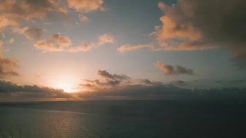 Sunset clouds over tranquil open ocean Stock Footage 345681288