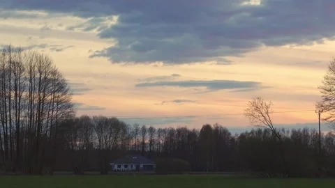 Sunset clouds over the trees. Stock Footage 154771746