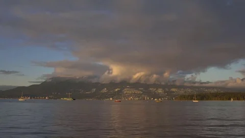Sunset clouds over West Vancouver with ocean foreground Video stock 73842519