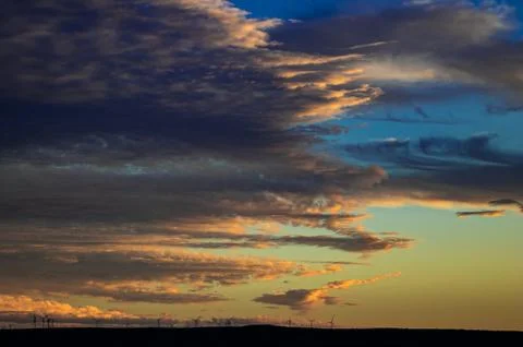 Sunset Clouds Over Wind Farm Stock Photos