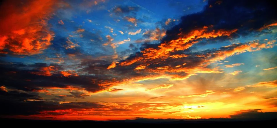 Sunset with clouds Stock Photos