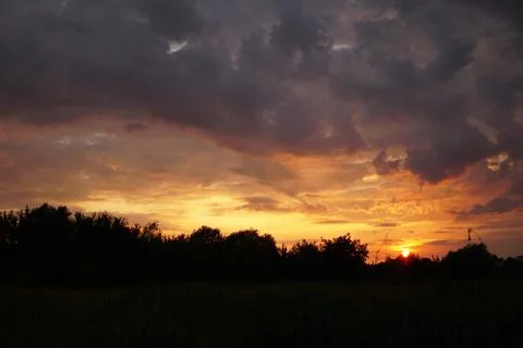 Sunset with clouds Stock Photos