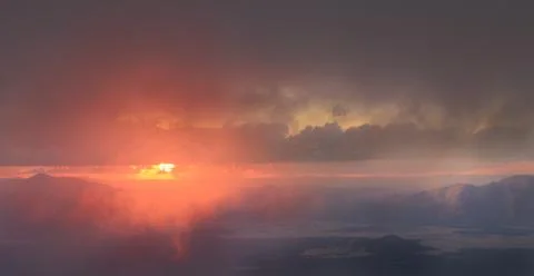 Sunset in the clouds Stock Photos