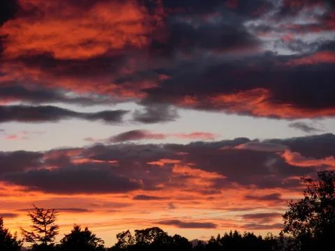 Sunset with clouds Stock Photos