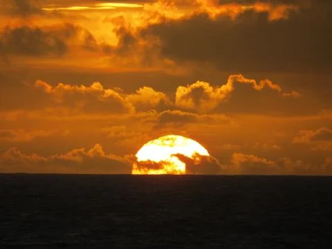 Sunset with clouds Stock Photos