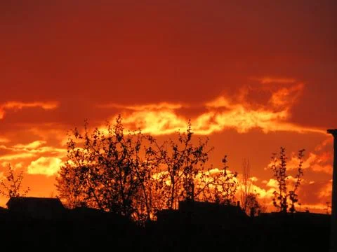 Sunset Clouds red sun reflection effect dawn Fotos de archivo