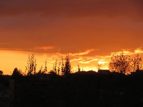 Sunset Clouds red sun reflection effect dawn Stock Photos