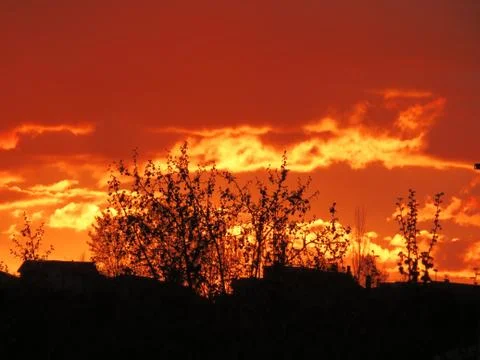 Sunset Clouds red sun reflection effect dawn Fotos de archivo