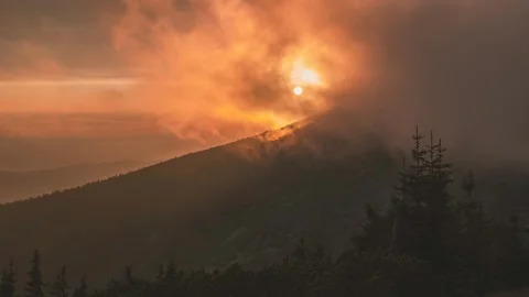 "Sunset with Clouds Rolling over Hill – Timelapse" 4K Stock Footage 316315751