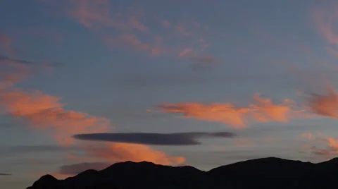 Sunset Clouds of Saturated Colors Over a Desert Landscape Stock Footage 35276110