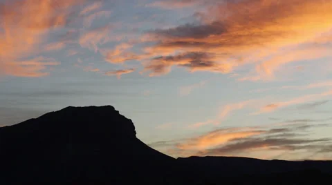 Sunset Clouds of Saturated Colors Over a Desert Landscape Stock Footage 35276886