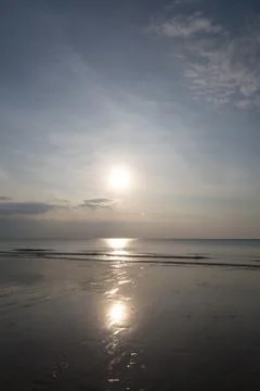 Sunset with clouds on sea Stock Photos
