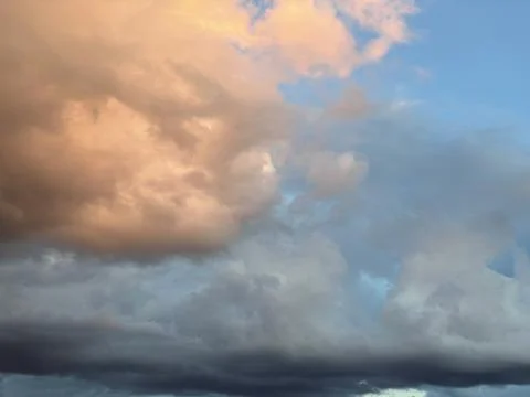 Sunset clouds in the sky. Natural texture and background. Dramatic sunset. Red Stock Photos