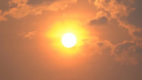 Sunset on clouds on summer background, cloud moving through sun and sunshine Stock Footage 127405085