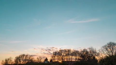 Sunset with clouds, sun disappearing on the horizon, timelapse 4k Stock Footage 147497653