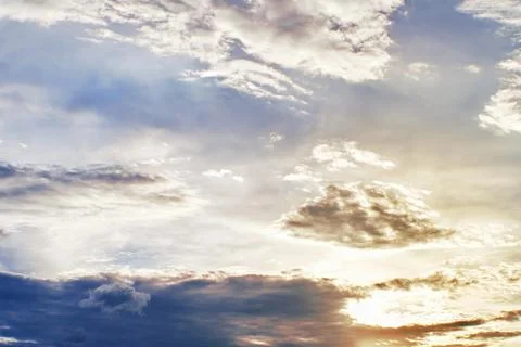 Sunset clouds with sun setting down. Beautiful evening sky with clouds Stock Photos