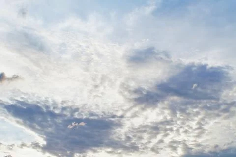 Sunset clouds with sun setting down. Beautiful evening sky with clouds Фото