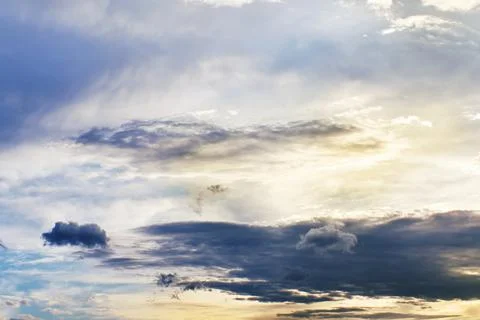 Sunset clouds with sun setting down. Beautiful evening sky with clouds Stock Photos