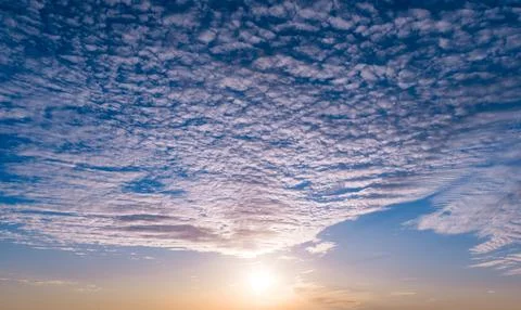 Sunset in cloudscape. Sunset rays on sky. Sunset bright air. Sunset glowing dusk Foto stock