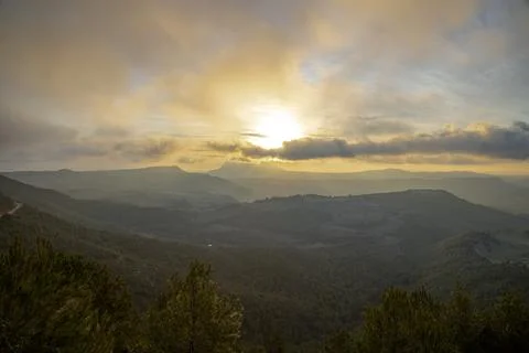 Sunset cloudy landscape Stock Photos