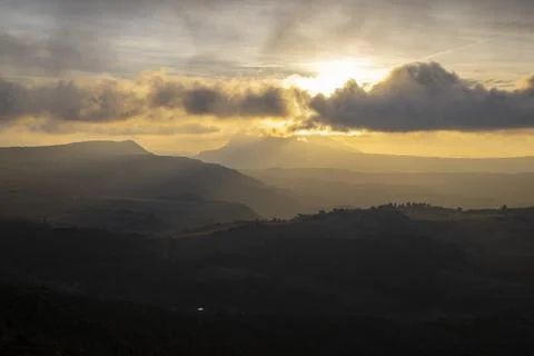 Sunset cloudy landscape Stock Photos