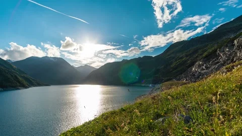 Sunset in a Cloudy Sky Above a Mountain Lake Stock Footage 149912265