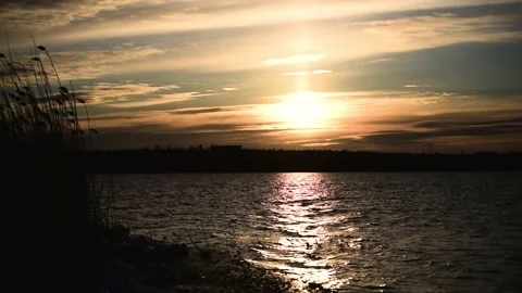 Sunset cloudy sky and sea-gulls flying above the river,magic beauty of nature. Stock Footage 168760677