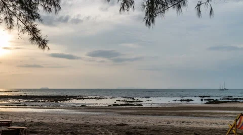 Sunset with cloudy sky, ocean and island on the horizon timelapse Stock Footage 50471711