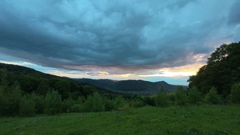 Sunset cloudy sky over mountains as background. Nature concept Stock Footage 330677358