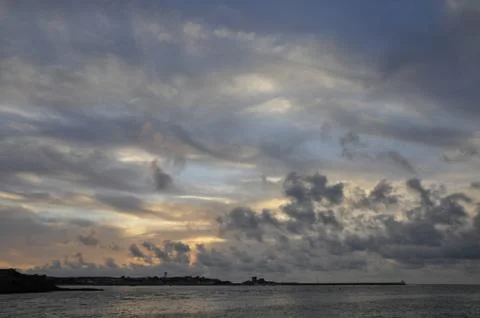 Sunset with a Cloudy Sky Stock Photos