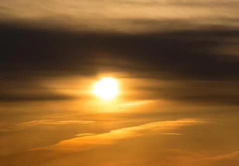 Sunset on cloudy sky Stock Photos