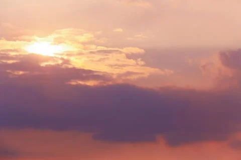 Sunset in the cloudy sky Stock Photos