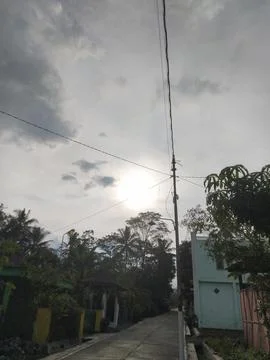 Sunset in cloudy sky Stock Photos