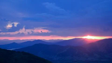 Sunset at cloudy weather Stock Photos