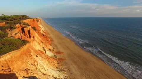 Sunset at coast cliffs beach aerial Portugal Algarve aerial view Stock Footage 58950413
