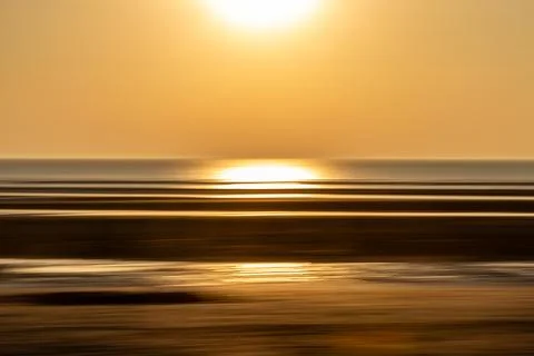Sunset at the coast, with intentional camera movement Stock Photos