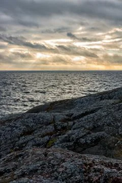 Sunset by coast Stock Photos