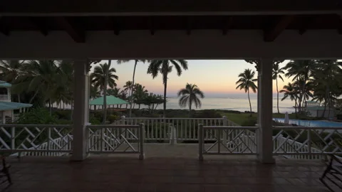 Sunset on the coast through pillars at Caribbean resort Stock Footage 137965361