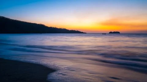 Sunset on a coastal beach. Stock Photos