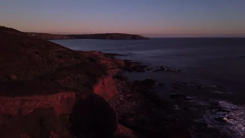 Sunset Coastline and Cliffs — Slow Aerial Tracking Shot Along Coast Stock Footage 325855105