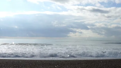 Sunset Coastline with Floating Magical Particles in the Air 4K Stock Footage 325333045