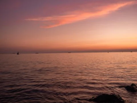 Sunset on a coastline Stock Photos