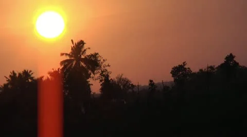 Sunset with coconut palm trees in the foreground Stock Footage 22328638