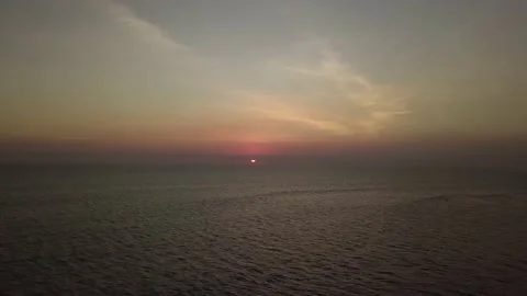 Sunset with colorful sky over ocean Video stock 155460015