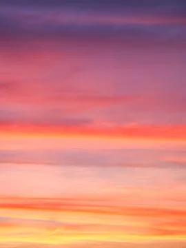 Sunset colors blend to create a romantic atmosphere; ideal for love themes. Stock Photos